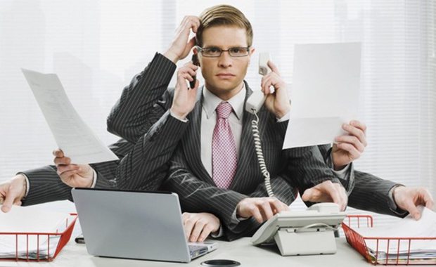Illustration of a businessman as an octopus juggling many tasks at once