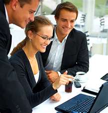 Colleagues collaborating at a computer